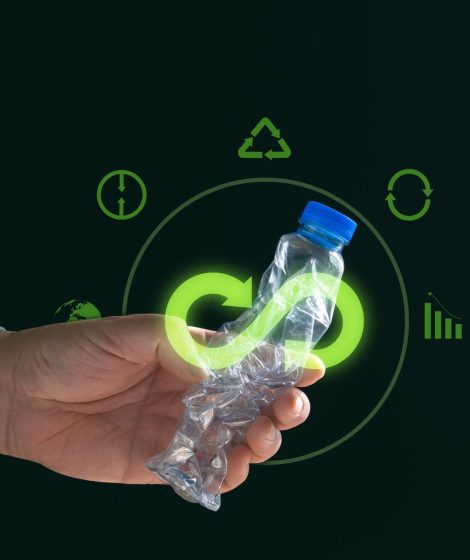 Bio,Circular,Green,Economy,Concept.,Hand,Holding,Crushed,Plastic,Bottle